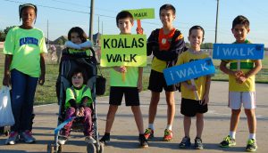 Students pose for a Walk to School Day photo in Odessa, Texas