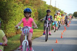 Students writing their during National Bike to School day in Nags Head, North Carolina.