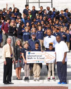 Students and community leaders in Providence, Rhode Island, post for a photo during Walk to School Day.