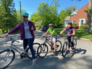 Mother and kids on bicycles